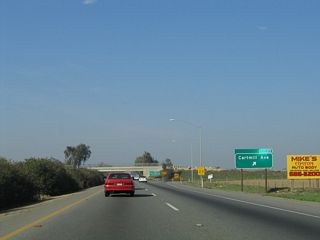 Northbound California 99 (Golden State Highway) reaches Exit 89, Cartmill Avenue in Tulare.