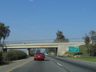 The next exit along California 99 north is Exit 90, Oaks Street (0.50 mile). Soon after this interchange, traffic from California 99 Business (J Street) will merge back onto California 99 north from the left.