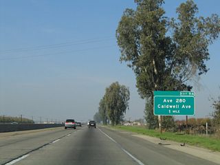 The next exit along California 99 north is Exit 94, Avenue 280, which is also known as Caldwell Avenue (one mile). Caldwell Avenue roughly parallels California 198. To the west, it changes into Houston Avenue upon entering Kings County, connecting to the city of Lemoore and the California 41 corridor.