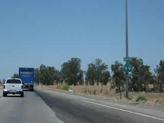 A California 99 north reassurance shield is posted after the on-ramp from California 198.