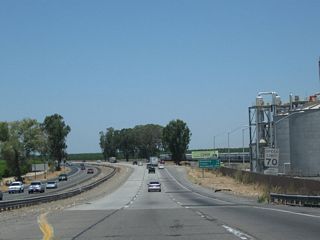 After passing under Betty Drive, California 99 expands to three northbound lanes.