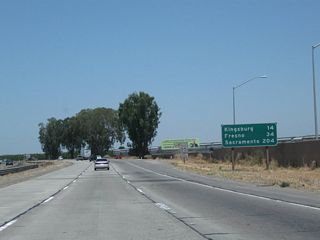 Leaving Goshen, this mileage sign along California 99 (Golden State Highway) north provides the distance to Kingsburg (14 miles), Fresno (34 miles), and Sacramento (204 miles).