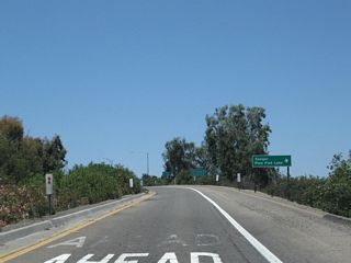 Signage along the off-ramp at Exit 111 to Road 12 south and 18th Avenue (Mendocino Avenue) north to Kingsburg. Although 18th Avenue north leads into the Kingsburg business district, this route is not an officially recognized business loop of California 99. To the old alignment of U.S. 99 (Golden State Boulevard), continue straight ahead onto Davis Avenue, which connects to the south end of Golden State Boulevard, a very long, old expressway that predates the freeway alignment of U.S. 99. This was a very long business route leading north from Kingsburg to Fresno, but no signs remain in place today for the former business loop. For old highway buffs, it is fun to drive this old expressway as it still has many of the older stylings that harken back to a different era of highway building.