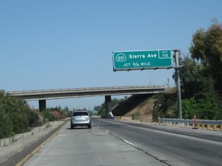 The next exit along California 99 north is Exit 112, California 201 (Sierra Street) east and Sierra Street west (to Conejo Avenue west) (three-quarters of a mile). California 201 travels east from this interchange to California 245 near Woodlake via Culter and Yettem. This sign is actually located within Tulare County, but the actual interchange is located in Fresno County.