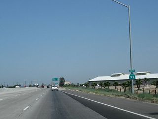 This California 99 north reassurance shield is posted after the on-ramp from California 201 (Sierra Street). Ahead, the next exit is to Bethel Avenue and Kamm Avenue.