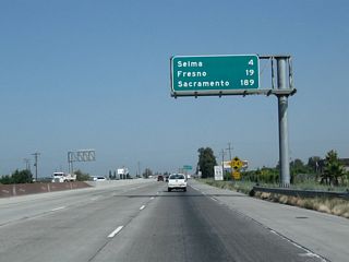 This mileage sign along California 99 north provides the distance to Selma (four miles); Fresno (19 miles); and Sacramento (189 miles).