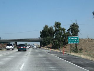 Upon passing under Manning Avenue, California 99 enters the city of Fowler ("The Blossom Trail City"). Fowler was incorporated on June 15, 1908, and had a population of 5,570 as of the 2010 Census. The "blossom trail" refers to Fowler's position on the Fresno County Blossom Trail, which is notable in the spring for the flowering and fruiting trees (such as citrus, almond, plum, peach, apple, and apricot trees) found along agricultural backroads in the orchards east of California 99.