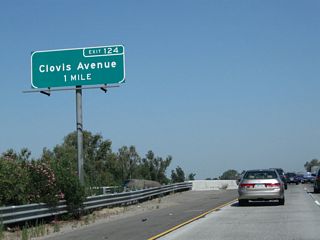 The next exit along California 99 north is Exit 124, Clovis Avenue (one mile). Clovis Avenue is a north-south highway that provides an alternate route to eastbound California 180/Kings Canyon, the Fresno Airport and Clovis.