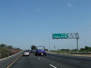 Northbound California 99 meets Exit 124, Clovis Avenue.