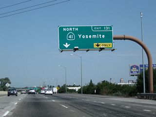 The right two lanes of California 99 will connect to Exit 131, California 41 (Yosemite Freeway) north. California 99 enters downtown Fresno at this interchange; the center city is bounded by California 99 on the southwest, California 180 on the north, and California 41 on the east. California 41 travels almost due north-south through Fresno. Take California 41 north to Coarsegold, Oakhurst, and Yosemite National Park.