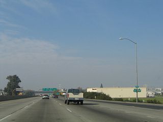 Before California 41 (Yosemite Freeway) was extended south of California 99, the two routes shared alignment briefly between Jensen Avenue and the California 41 interchange. This co-signed route marker was in place in 2004 but gone by 2011. Now California 41 is a continuous route through Fresno with no shared segments with California 99.