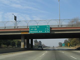 This mileage sign along California 99 north provides the distance to the next three exits: Exit 132B, Fresno Street (Former California 180 west); Exit 133, California 180 (Sequoia-Kings Canyon Freeway) east and west; and Exit 134, Belmont Avenue.