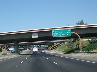 This interchange sequence sign along California 99 north provides the distance to the next three exits: Exit 134, Belmont Avenue; Exit 135A, Olive Avenue; and Exit 135B, McKinley Avenue.