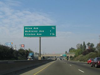 This interchange sequence sign along California 99 north provides the distance to the next three exits: Exit 135A, Olive Avenue; Exit 135B, McKinley Avenue; and Exit 136, Clinton Avenue.