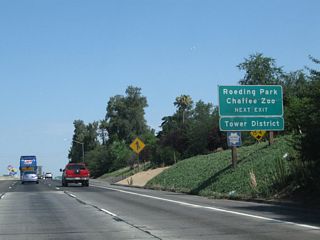 Use Exit 135A, Olive Avenue to Roeding Park, Fresno Chaffee Zoo, and Fresno's Tower District. Roeding Park is a large park situated east of California 99, west of Golden State Boulevard (Old U.S. 99), north of Belmont Avenue, and south of Olive Avenue. Located within Roeding Park, Fresno Chaffee Zoo is Fresno's regional zoological park, complete with animal exhibits. Fresno's Tower District is a large arts, dining, and entertainment district located along Wishon Avenue between Olive Avenue and McKinley Avenue.