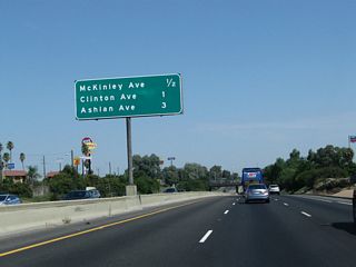 This interchange sequence sign along California 99 north provides the distance to three of the next four exits: Exit 135B, McKinley Avenue; Exit 136, Clinton Avenue; Exit 138A, Golden State Boulevard; and Exit 138B, Ashlan Avenue.