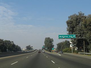 Northbound California 99 meets Exit 135B, Olive Avenue.