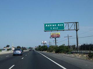 Prior to Exit 138A, North Golden State Boulevard, an advance sign is posted along California 99 for Exit 138B, Ashlan Avenue (one mile).