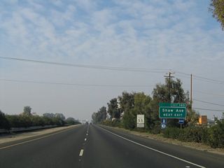 Shaw Avenue is old California 168 before that state route was transferred onto the Fresno freeway system. When the California 168 freeway was completed, the western terminus of California 168 was transferred from California 99 to California 180. Note the landscaped median in place prior to the freeway expansion project in 2011.