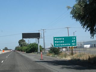 This mileage sign along California 99 north provides the distance to Madera (13 miles), Merced (47 miles), and Sacramento (161 miles).