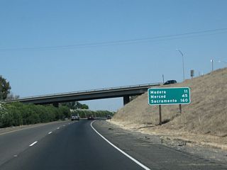 This mileage sign along California 99 north provides the distance to Madera (11 miles), Merced (45 miles), and Sacramento (160 miles).