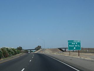 Northbound California 99 meets Exit 147, Avenue 9 and Road 30 1/2.