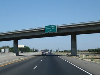 The next exit along California 99 north is Exit 153A, California 99 Business (Gateway Drive) in Madera. California 99 Business follows Historic U.S. 99 through downtown Madera via Gateway Drive.