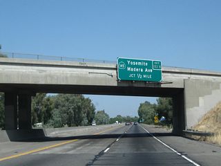 The next exit along northbound is Exit 153B, California 145 (Madera Avenue). The routing of California 145 is shaped like a backward "7," with the kink in the route at Madera. California 145 leads south toward Ripperdan and east toward Millerton Lake.