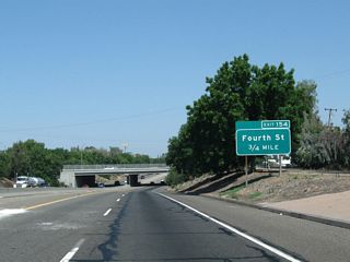 The next exit along California 99 north is Exit 154, Fourth Street (0.75 mile). This sign is posted right after the off-ramp to Exit 153.