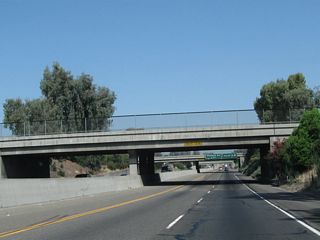 In sequence after passing under Madera Avenue, California 99 passes under Sixth Street, Yosemite Avenue, and Fourth Street.