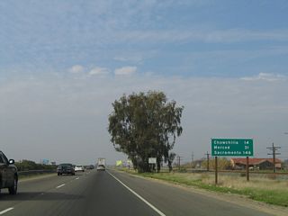 This mileage sign along California 99 north provides the distance to Chowchilla (14 miles), Merced (31 miles), and Sacramento (146 miles).