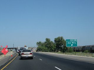 Northbound California 99 reaches Exit 159, Avenue 18 1/2.