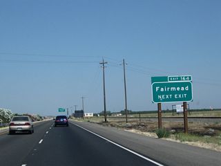 The next exit along California 99 north is Exit 164, Avenue 21 1/2 and Road 20. Use Road 20 north to Fairmead.