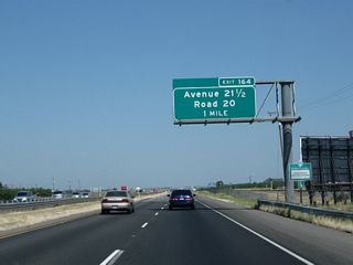 California 99 north approaches Exit 164, Avenue 21 1/2 and Road 20 to Fairmead (one mile).