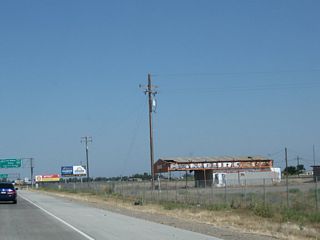 Freeway construction resulted in the elimination of the direct connection between California 99 and Avenue 22 1/2.