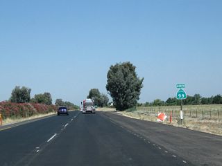 A California 99 north reassurance shield is posted after the on-ramp from Exit 168 (Avenue 24 1/2).