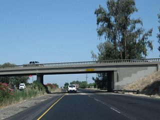 California 99 passes under California 233 (Robertson Boulevard).