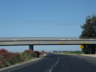 California 99 passes under Minturn Road (Road 15).