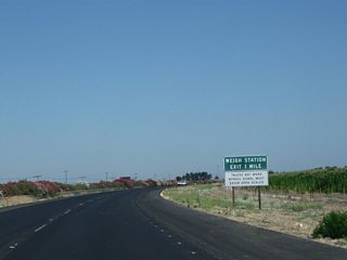 The next exit along California 99 north is Exit 172, Weigh Station (one mile). The 2011 pictures were taken during a repaving project along this stretch of California 99 in northern Madera County.