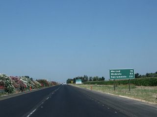 This mileage sign along California 99 (Golden State Highway) north provides the distance to Merced (16 miles), Modesto (53 miles), and Sacramento (131 miles).