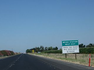 Another weigh station advance sign is posted shortly thereafter.