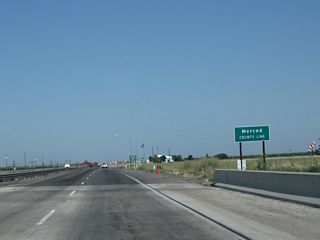 California 99 leaves Madera County upon crossing the Chowchilla River and enters Merced County.