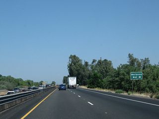 The last at-grade intersection (aside from a few driveway access points) along this section of California 99 expressway is with Mariposa Way.