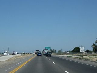 As of 2011, the freeway along California 99 resumes after the Mariposa Way intersection, resulting in the elimination of all remaining at-grade intersections between here and the Childs Road (Exit 186A) interchange.