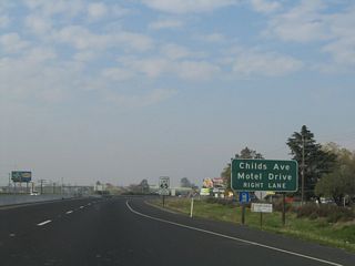California 99 north approaches Exit 186A, Childs Avenue and Motel Drive. An extant segment of Historic U.S. 99 follows Motel Drive, which is a frontage road on the east side of the freeway. However, the official business route into Merced leaves California 99 at Exit 186C. Childs Avenue parallels California 140 to the south, connecting Merced with Planada.