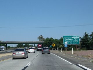 The next exit along California 99 north is Exit 186B, California 140 east to Planada, Catheys Valley, Mariposa, and Yosemite National Park.