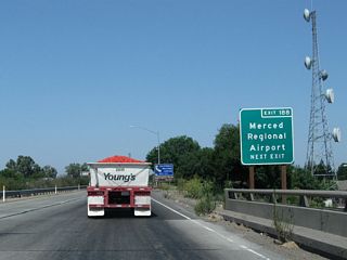 For a brief period (between Exit 187B and 188), California 99 shares pavement with California 59 north and California 140 west. However, both companion routes will exit the freeway at Exit 188. So again looking at the freeway mainline, the next exit along California 99 is Exit 188, California 59 north to Snelling and LaGrange and California 140 west to Gustine. Use Exit 188 to Merced Regional Airport (Macready Field). This sign is posted after the on-ramp from Martin Luther King, Jr. Way. There is no reassurance shield with all three routes (California 59, 99, and 140) together.