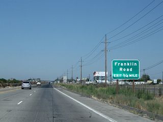 The next exit along California 99 north is Exit 191, Franklin Road. North-south Franklin Road lies between Merced and Atwater, connecting California 140 (McSwain Road) to the south and Merced County Route J-7 (Santa Fe Drive) to the north. J-7, which begins at California 59/Snelling Avenue north of Merced, travels northwest on a path parallel to California 99 from Merced northwest to Stockton.