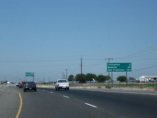 This mileage sign along California 99 north provides the distance to Livingston (six miles), Modesto (29 miles), and San Francisco (123 miles). Modesto and Sacramento, which appeared in the previous mileage sign, are omitted here.