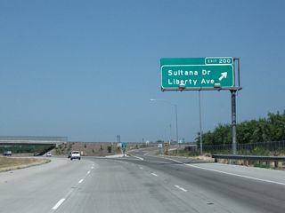 Northbound California 99 reaches Exit 200, Sultana Drive and Liberty Avenue.